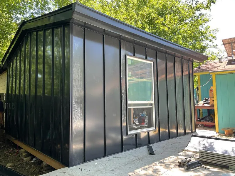 Black standing seam metal wall panels for Roof Inspection in Silvis